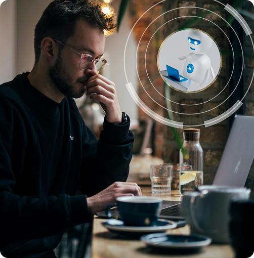 An image of a guy working on a laptop in a cafe, with a transparent floating picture in front of him of a robot in front of a laptop.
